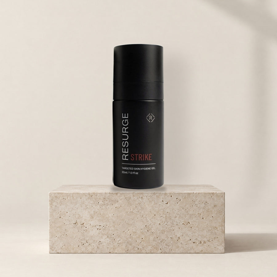 Resurge STRIKE targeted skin hygiene gel 30ml on a stone plinth