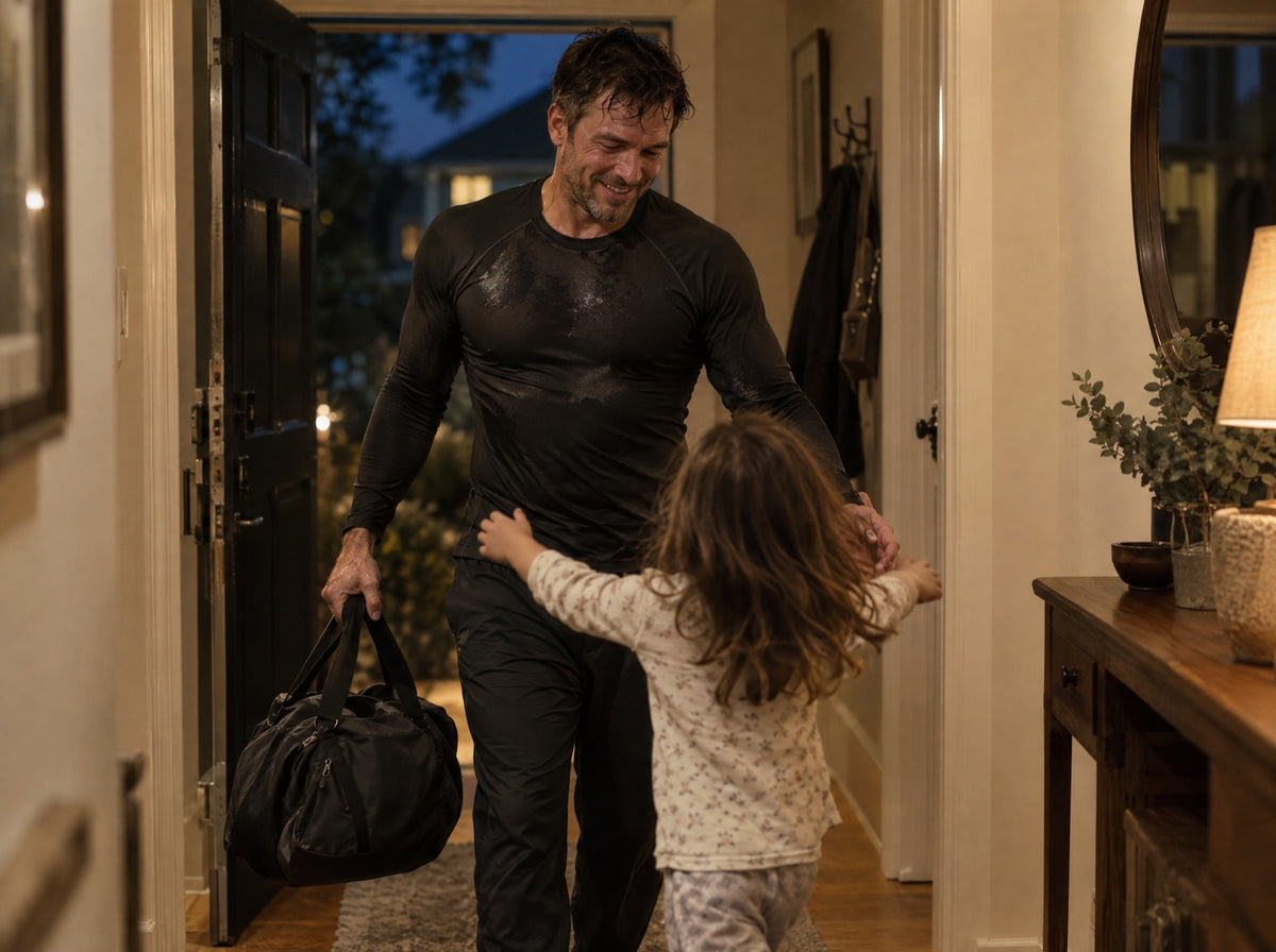 Grappler arriving home as his child runs to hug him