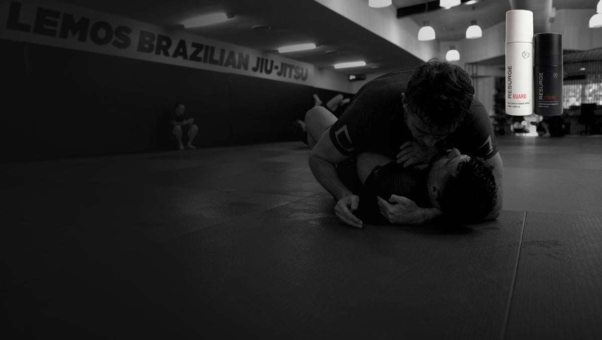 Josh on stage in the Resurge rashguard, with GUARD and STRIKE