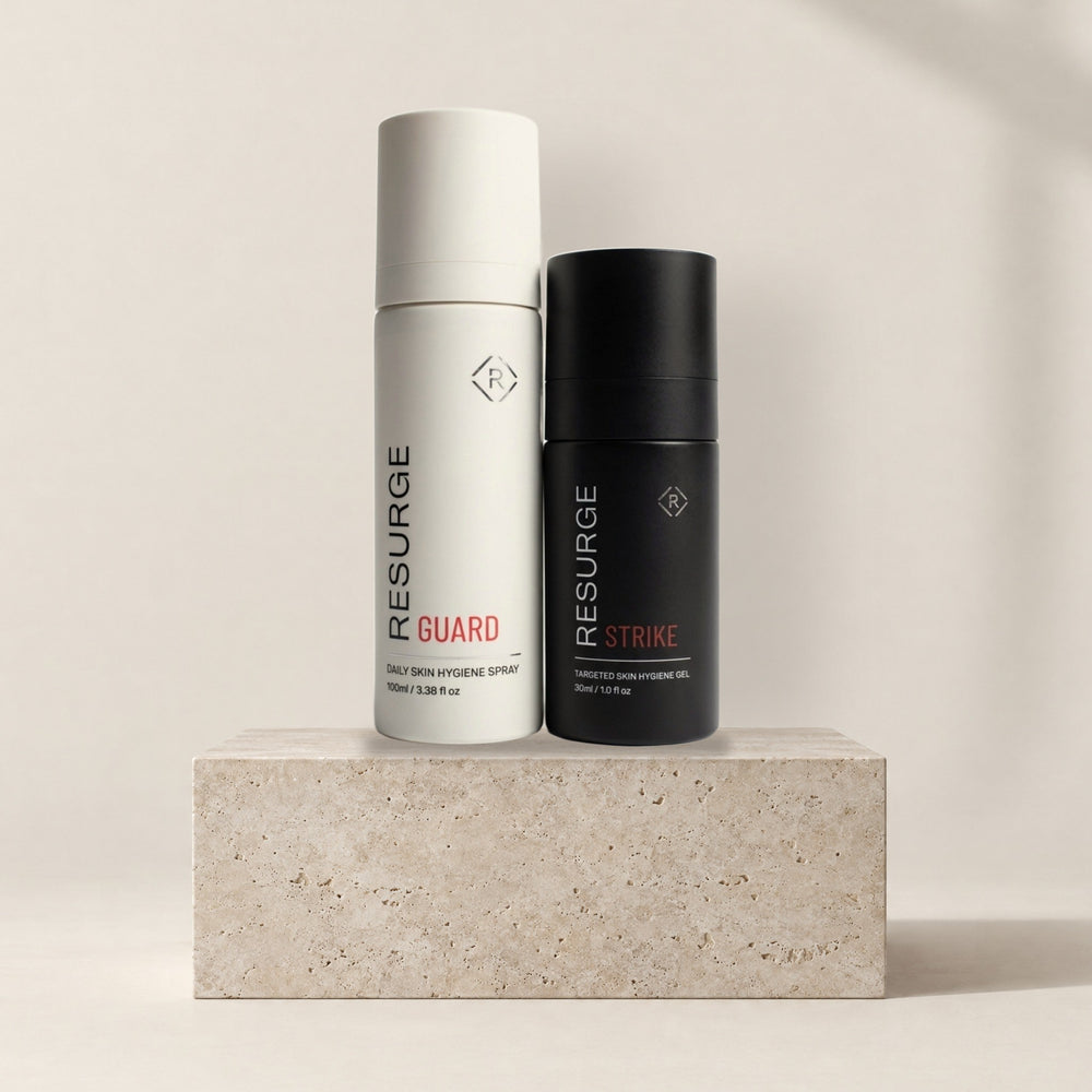 Resurge Combat Kit: GUARD daily skin hygiene spray 100ml and STRIKE targeted skin hygiene gel 30ml on a stone plinth